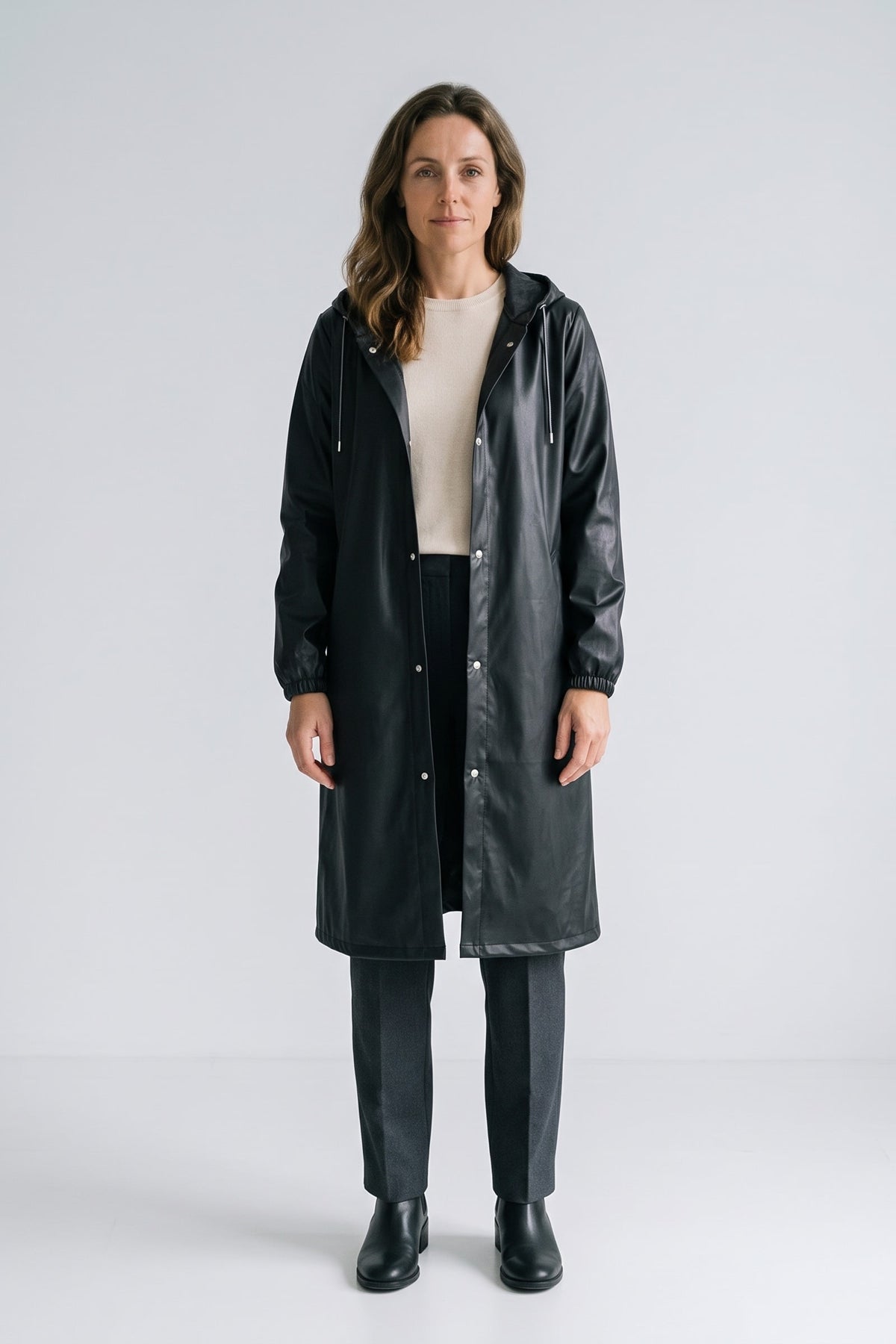 Women's Long Hooded Raincoat | Snap Front — Black — front view — on model
