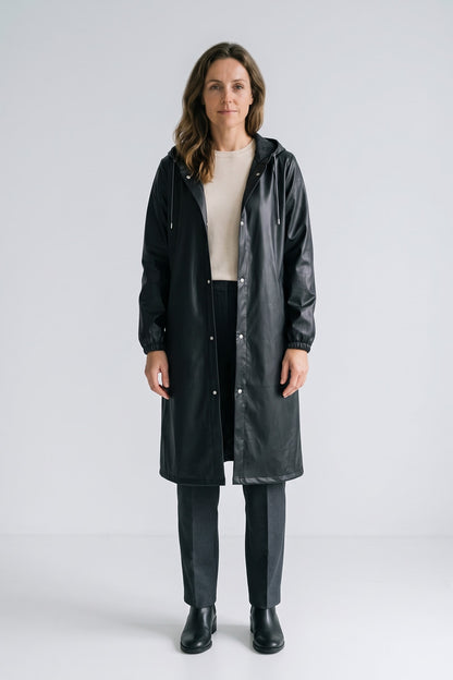 Women's Long Hooded Raincoat | Snap Front — Black — front view — on model