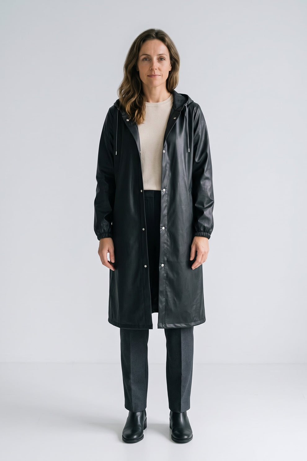 Women's Long Hooded Raincoat | Snap Front — Black — front view — on model
