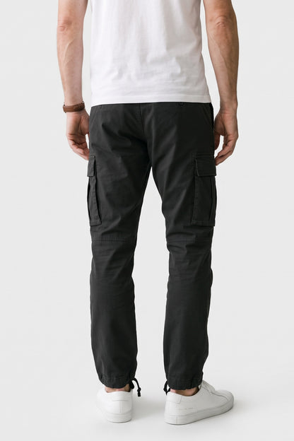 Men's Cargo Pants | Drawstring Ankle Cuffs — Black — back view — on model