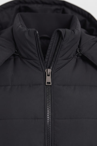 Women's Longline Puffer Coat | Hooded — Black — detail — on model