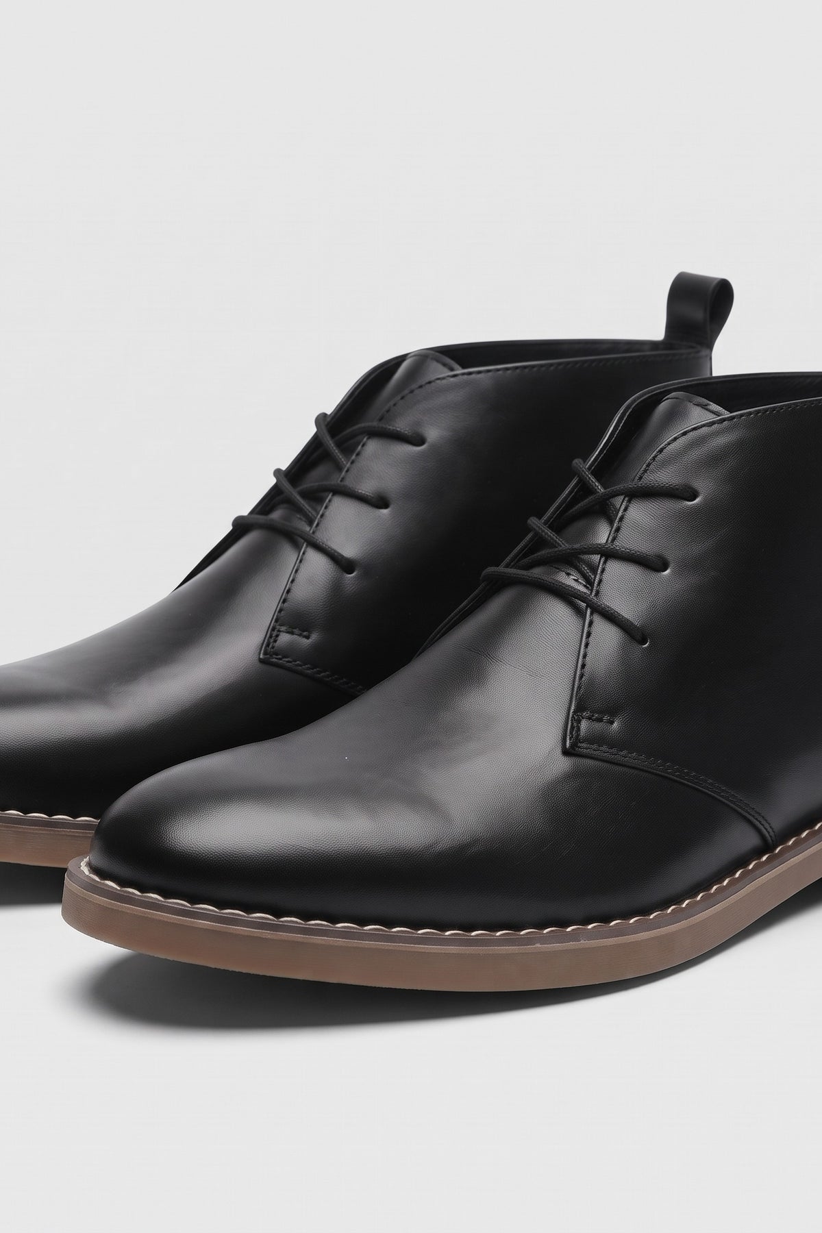 Men's Lace-Up Desert Boots | Round Toe — Black — shoe_detail — on model