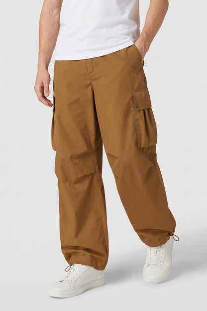 Men's Baggy Cargo Pants | Wide-Leg — Brown — front view — on model