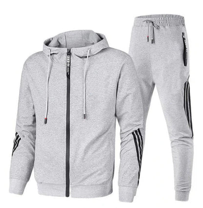 Men's zip-up hooded tracksuit set with striped sleeve panels and tapered joggers