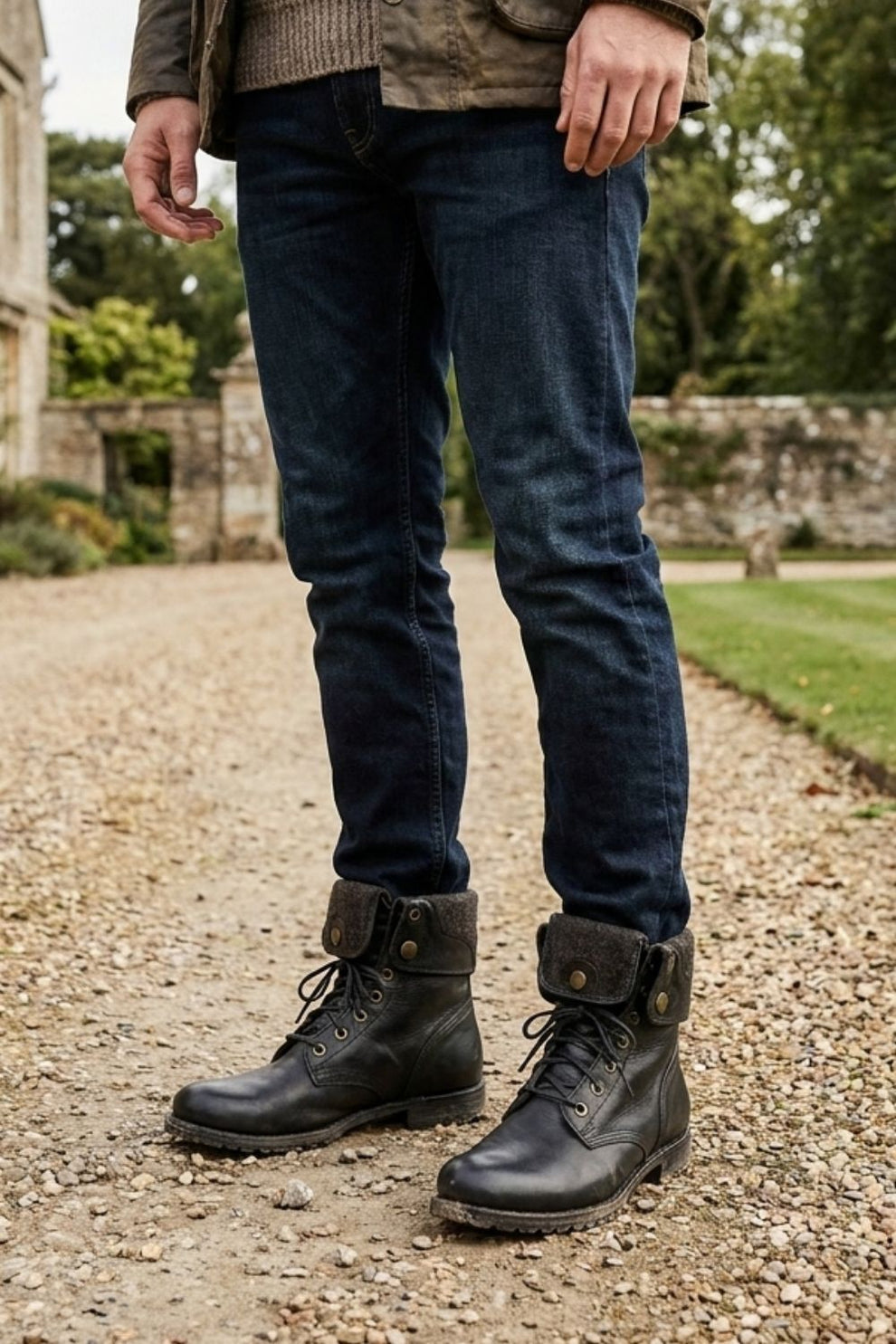 Men's black combat boots styled with jeans for fall and winter