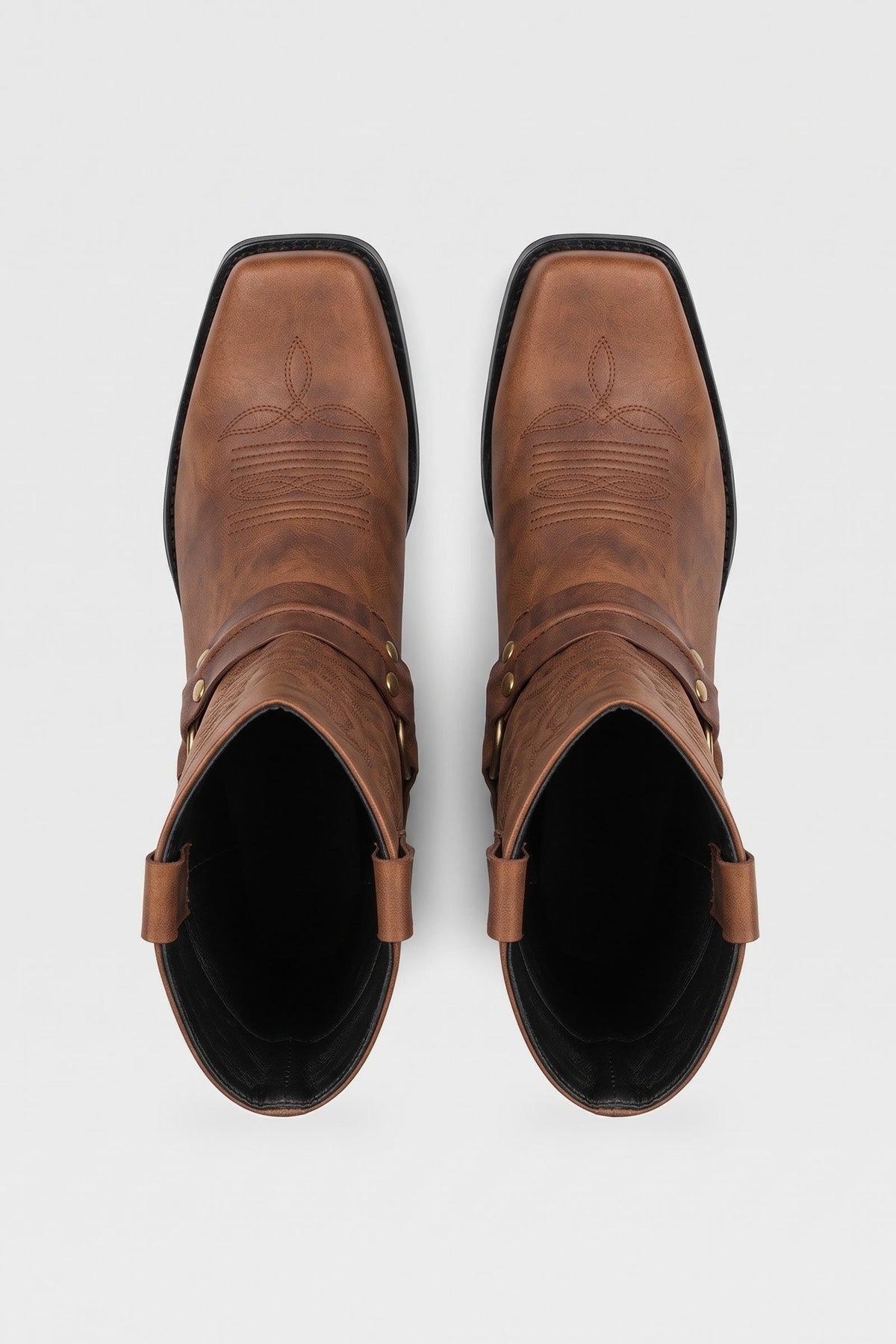 Men's brown harness boots seen from above, square toe