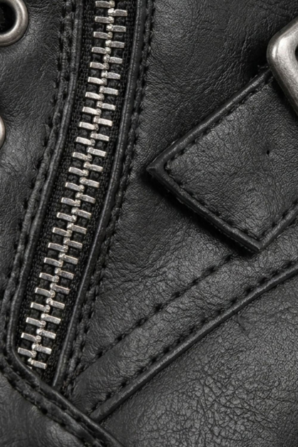 Detail of the side zip and chunky lug sole on men's combat boots