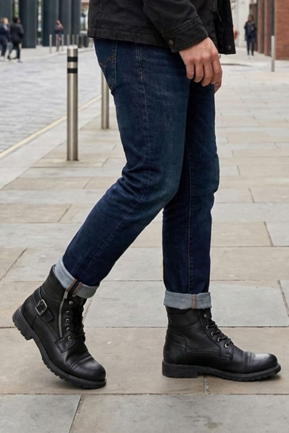 Men's black combat boots styled with jeans for everyday wear