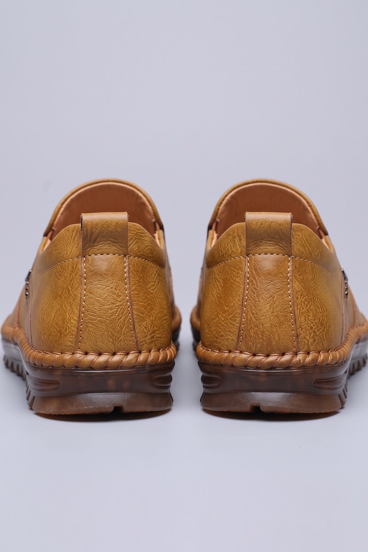 Men's Slip-On Loafers | Moc-Toe Stitching — Intense Orange — shoe_back — on model