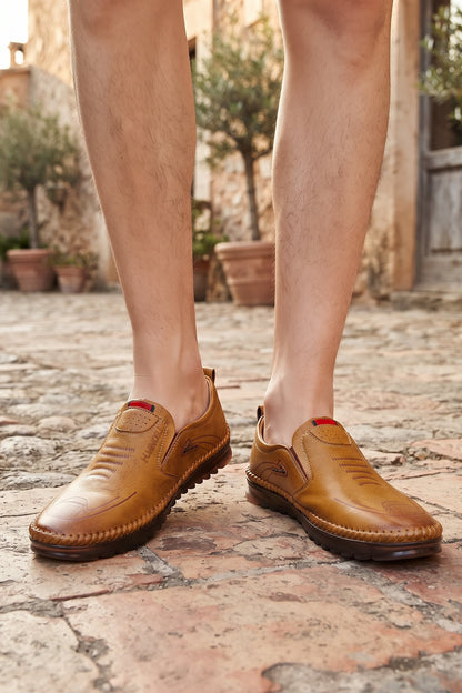 Men's Slip-On Loafers | Moc-Toe Stitching — Intense Orange — shoe_worn — on model