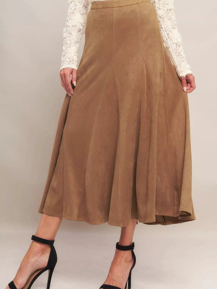 Camel panelled midi skirt with flared hem styled with black ankle strap heels