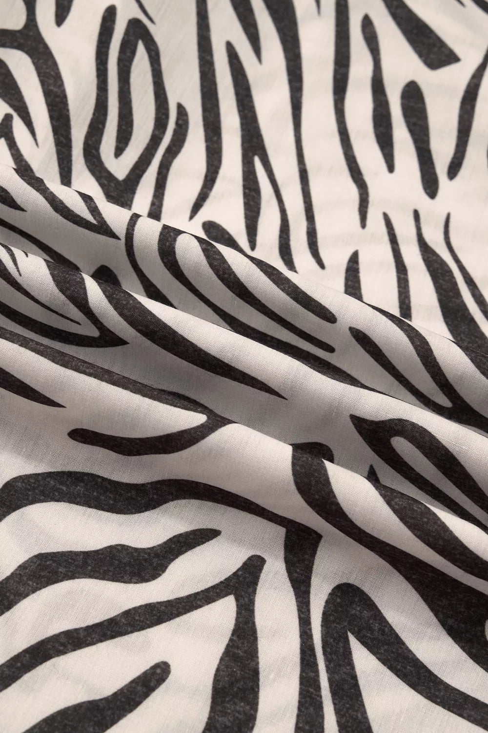 Close-up of the black and cream zebra stripe fabric