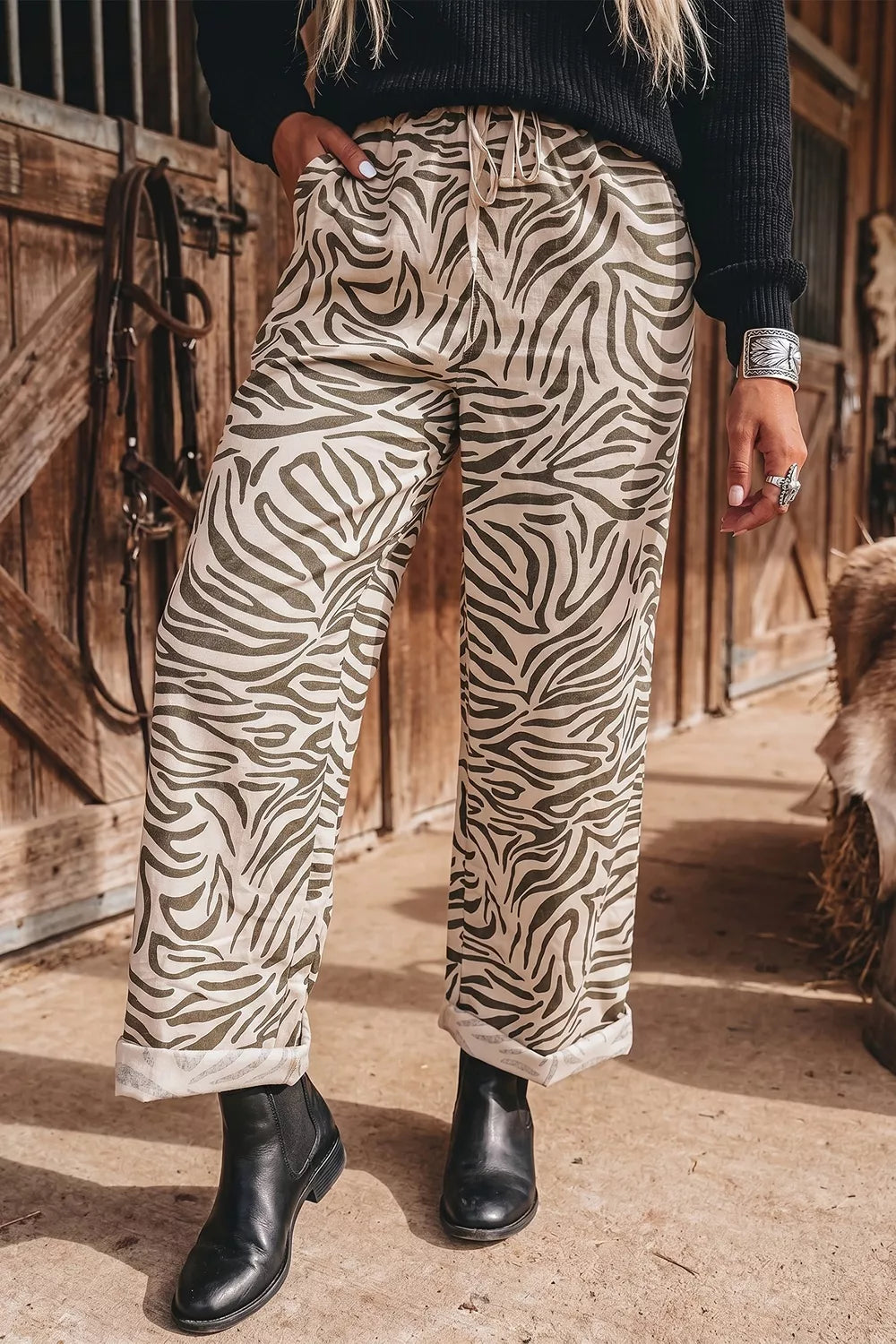 Women's animal print pants, zebra wide leg with drawstring waist, rolled hem with black boots