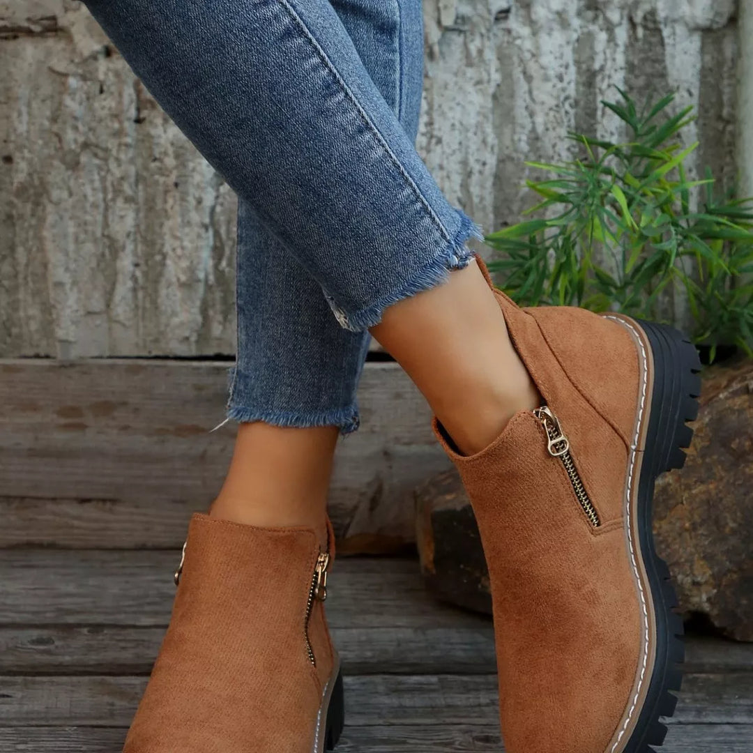 Camel block heel ankle boots front view with rolled hem jeans