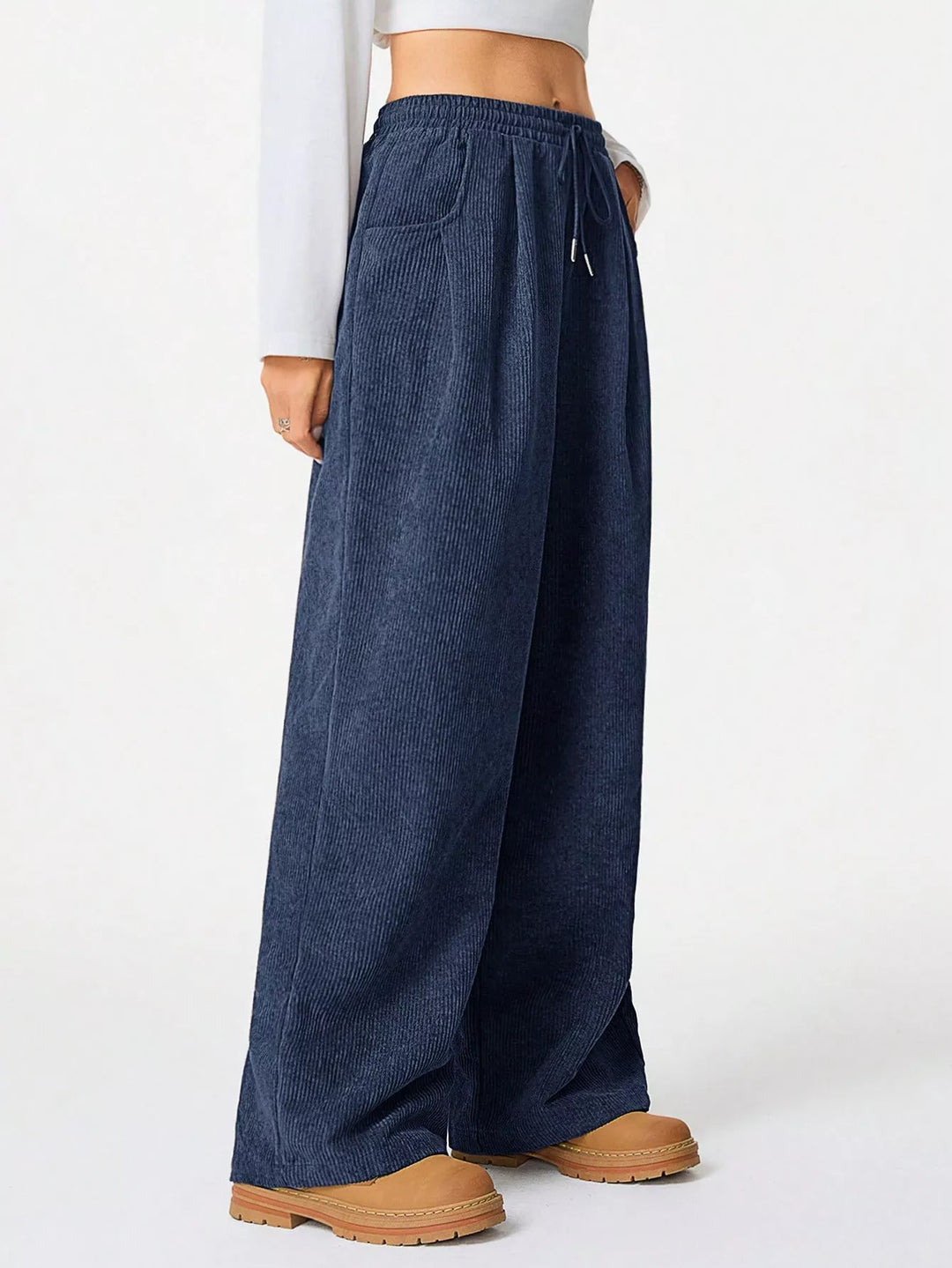 Front view of navy corduroy look pants with wide legs