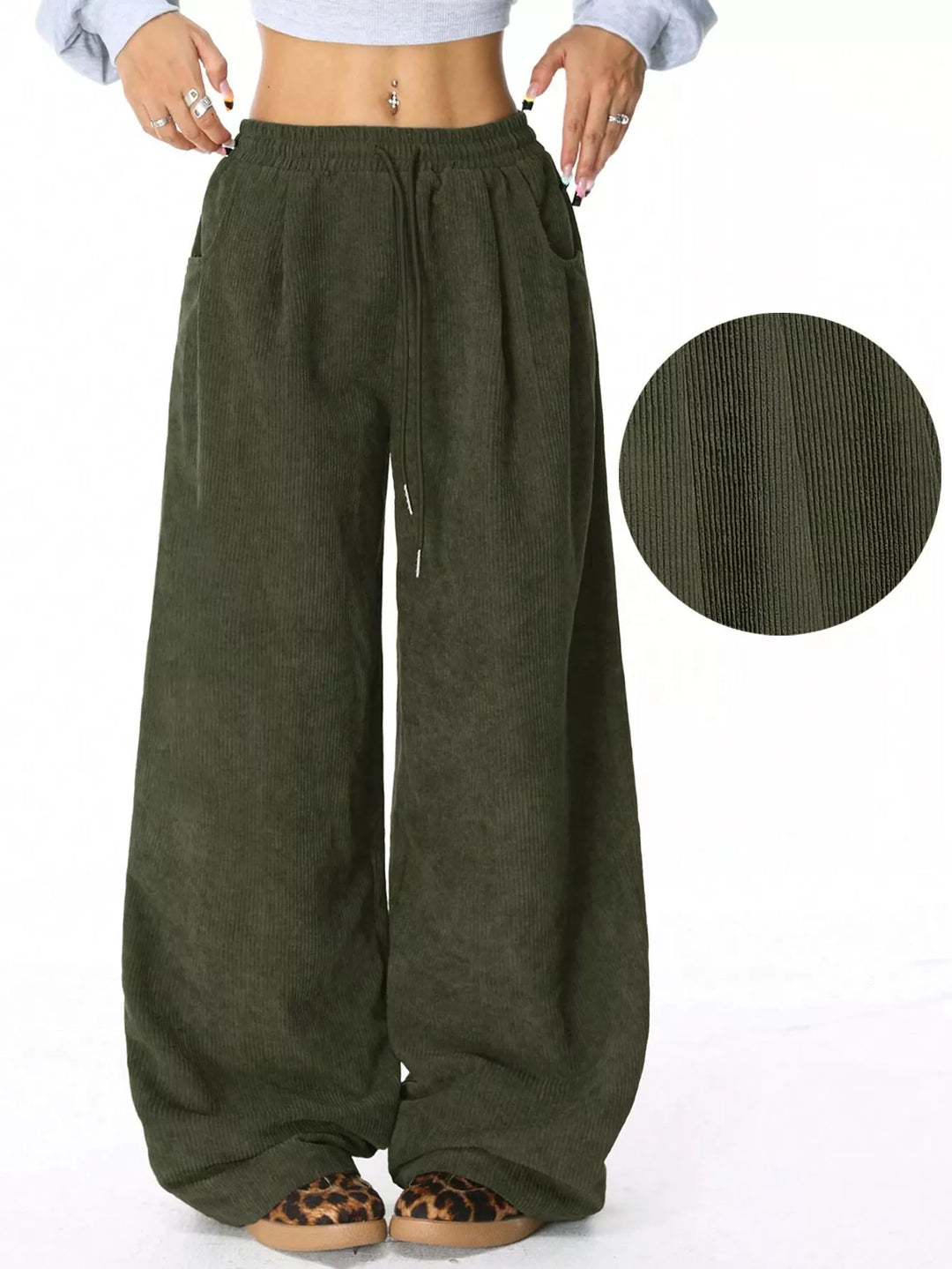 Olive baggy pants with drawstring waist and fabric texture inset