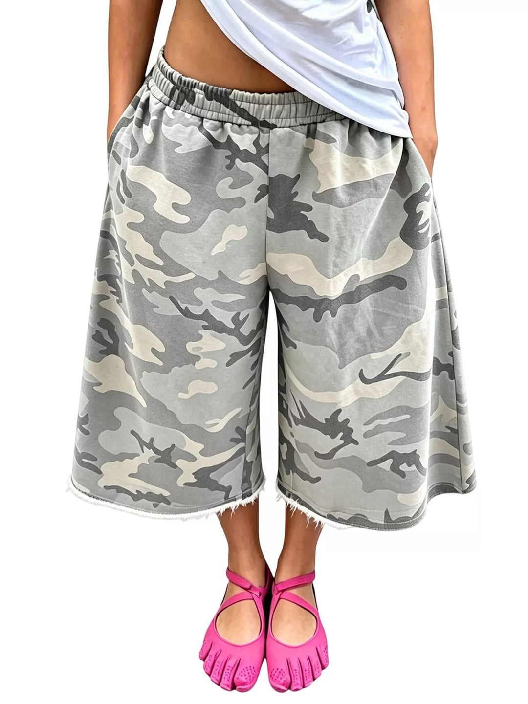 Gray camo wide leg knee length shorts with raw frayed edges