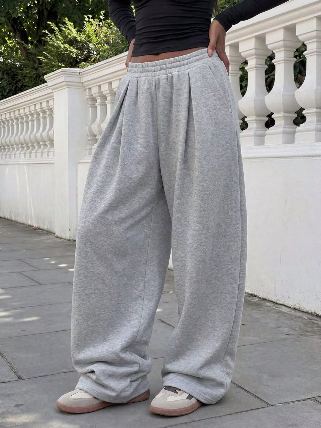 Light gray wide leg sweatpants, side angle showing the relaxed fit