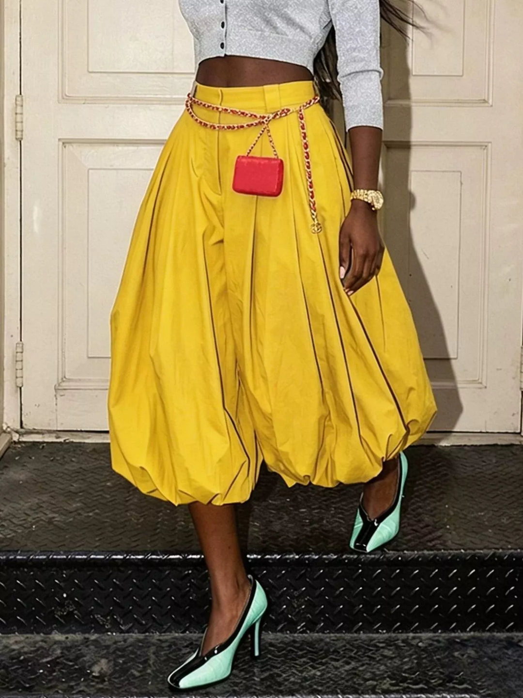 Yellow high waisted balloon pants with gathered bubble hem, front view