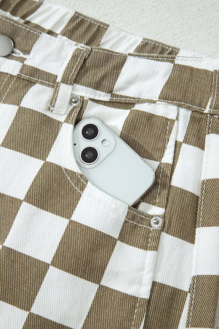 Front pocket holding a phone on the checkerboard barrel leg pants