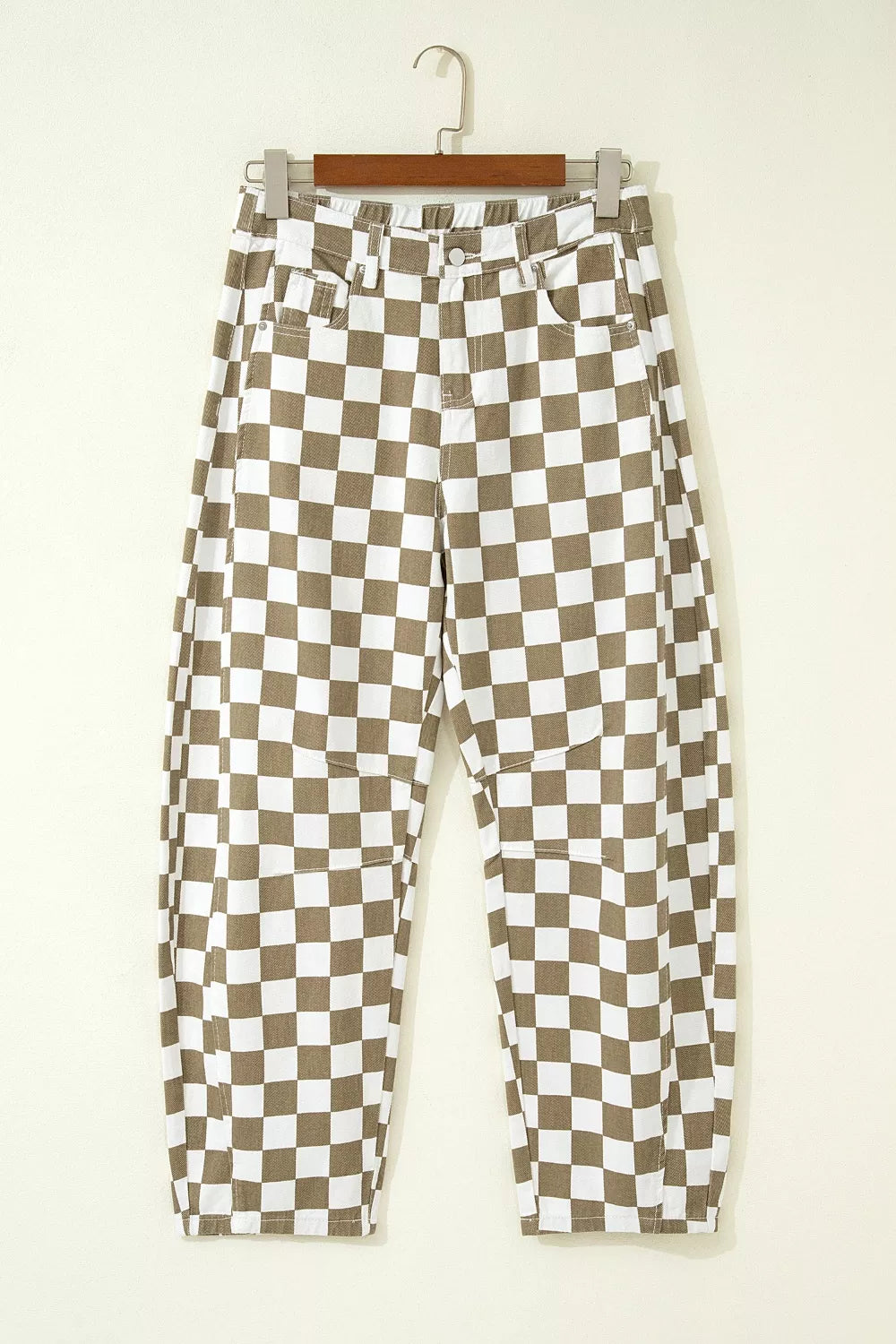 Khaki checkerboard barrel leg pants on a hanger, front view
