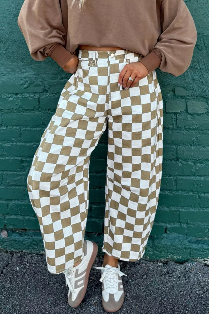Women's barrel leg pants in khaki checkerboard print, high waisted, styled with sneakers