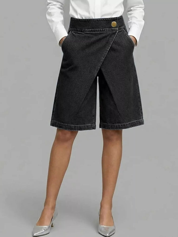 Black high waisted wrap front Bermuda shorts styled with a white shirt and heels