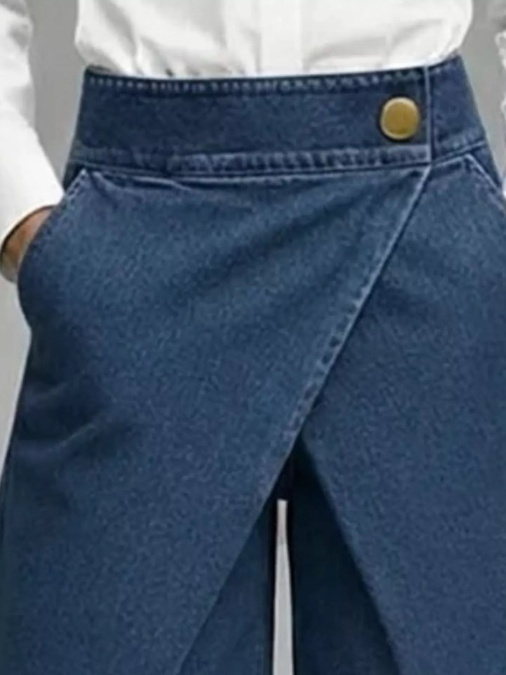 Close-up of the navy overlapping wrap front and button waistband