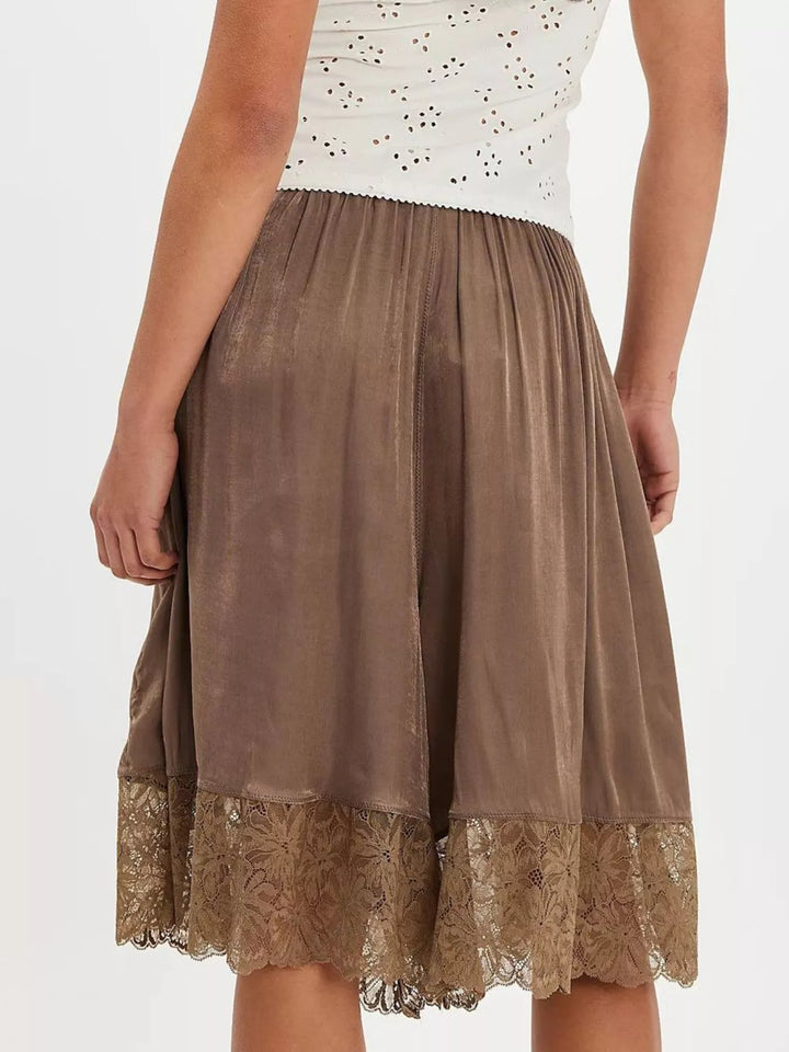 Back view of brown Bermuda shorts with lace trim hem