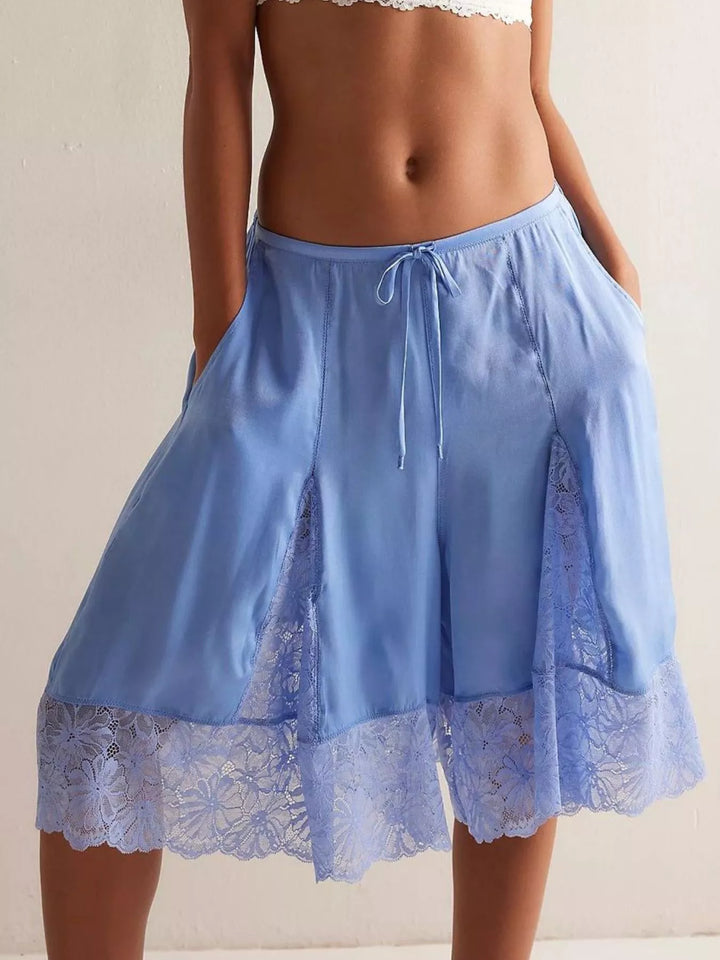 Light blue Bermuda shorts with lace trim hem, front view