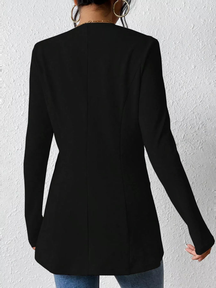 Black collarless blazer from behind showing the fitted back seams