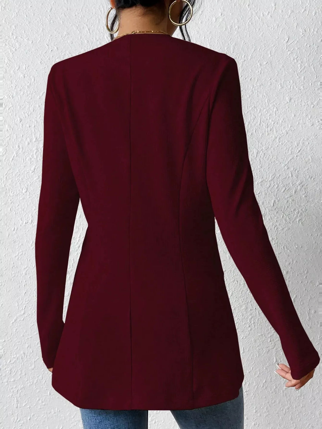 Burgundy blazer from behind showing the fitted back seams