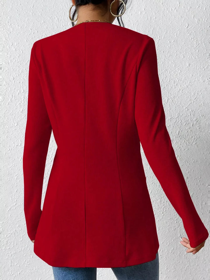 Back view of the red collarless blazer with a fitted shape