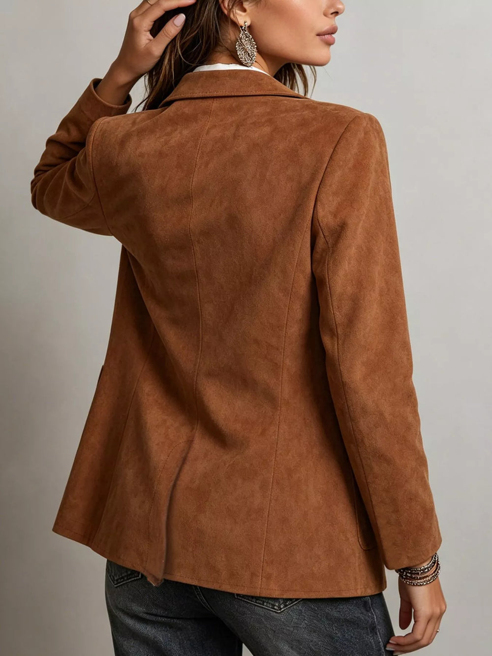 Back view of the cognac blazer with a relaxed fit