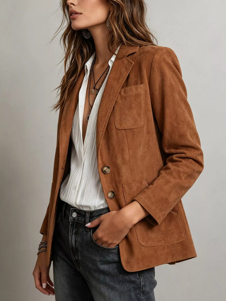 Cognac two button blazer side view with chest pocket and hand in jeans pocket