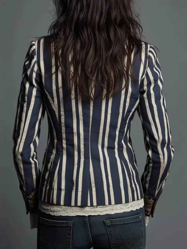 Back view of the navy striped blazer worn over a lace top