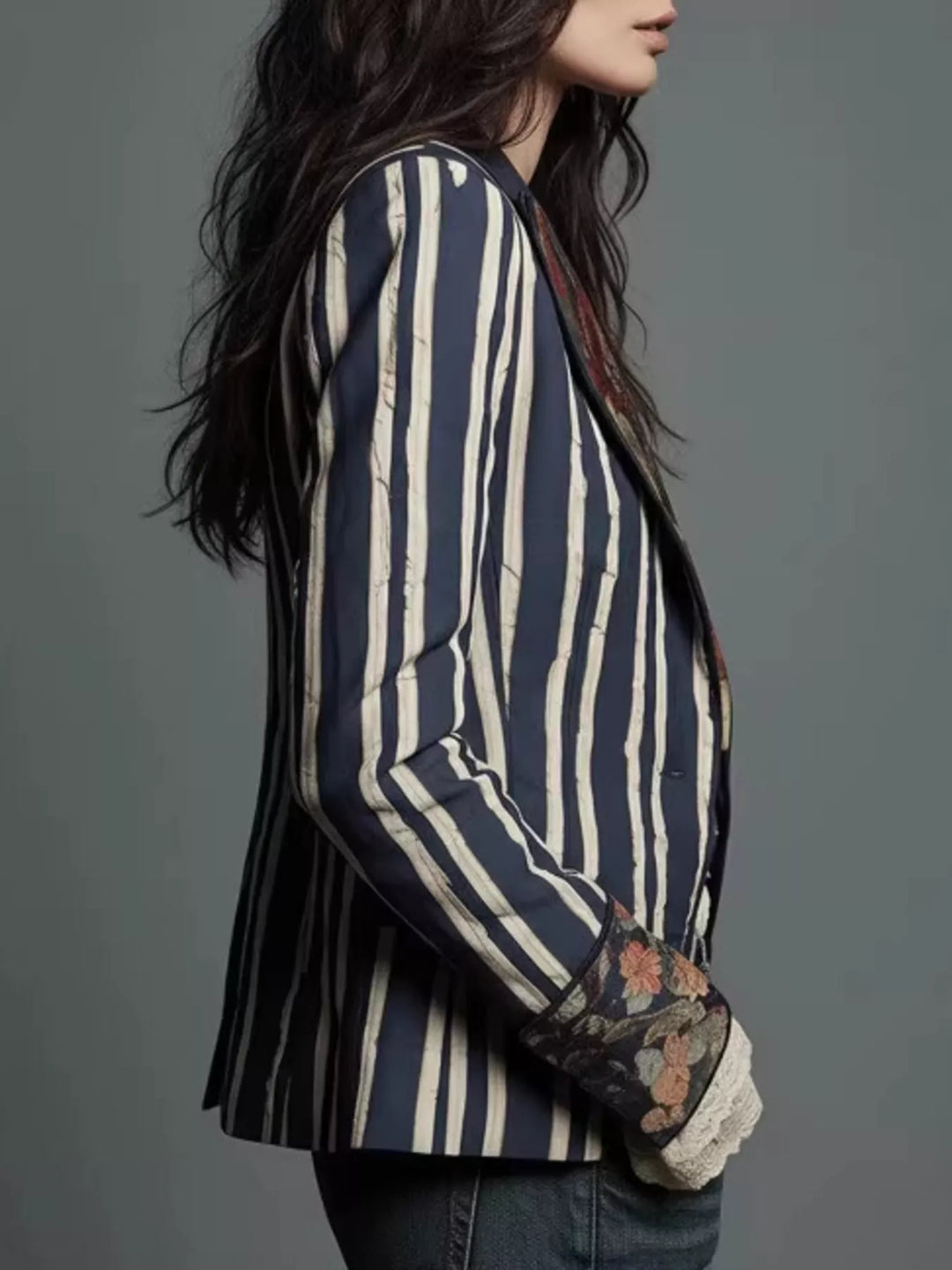 Side view of the striped blazer with floral cuff detail