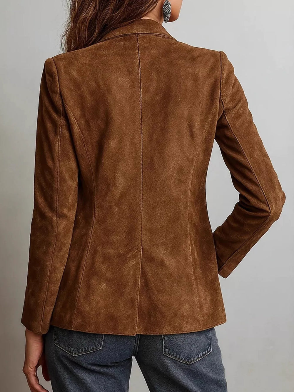 Back view of the cognac slim blazer with hand in jeans pocket