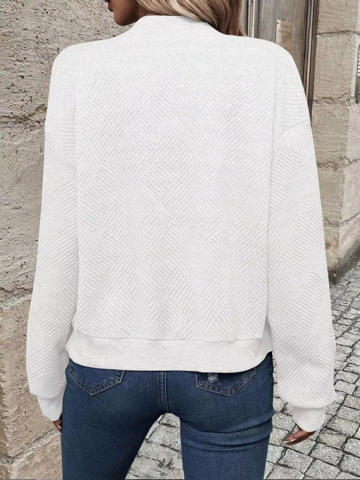 Back view of the white quilted diamond bomber jacket