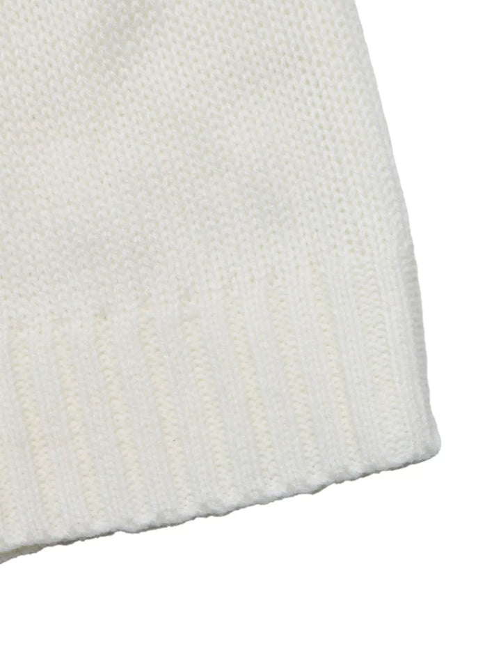 Close-up of the white sweater ribbed hem edge