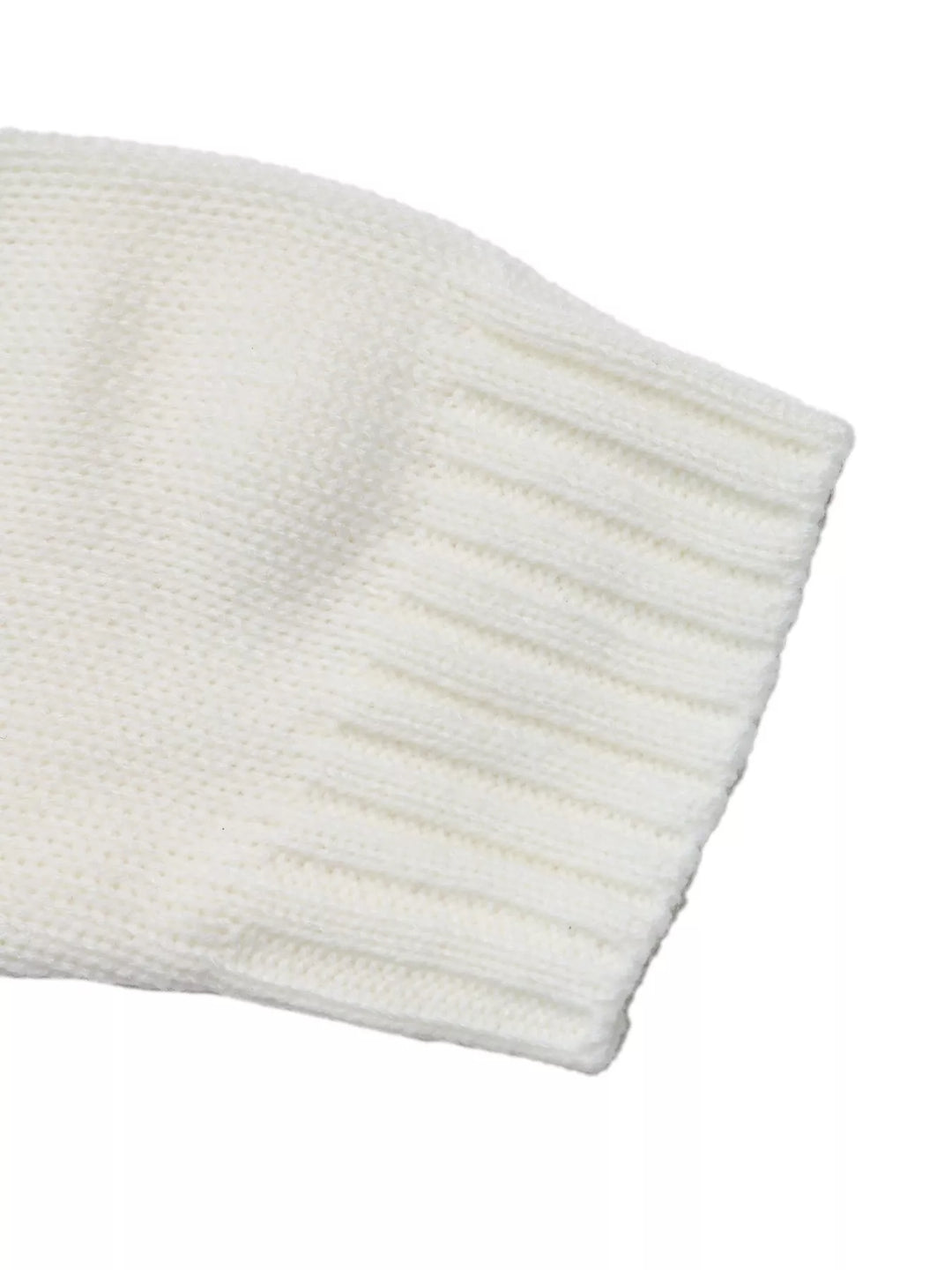 Close-up of the white sweater sleeve with ribbed cuff