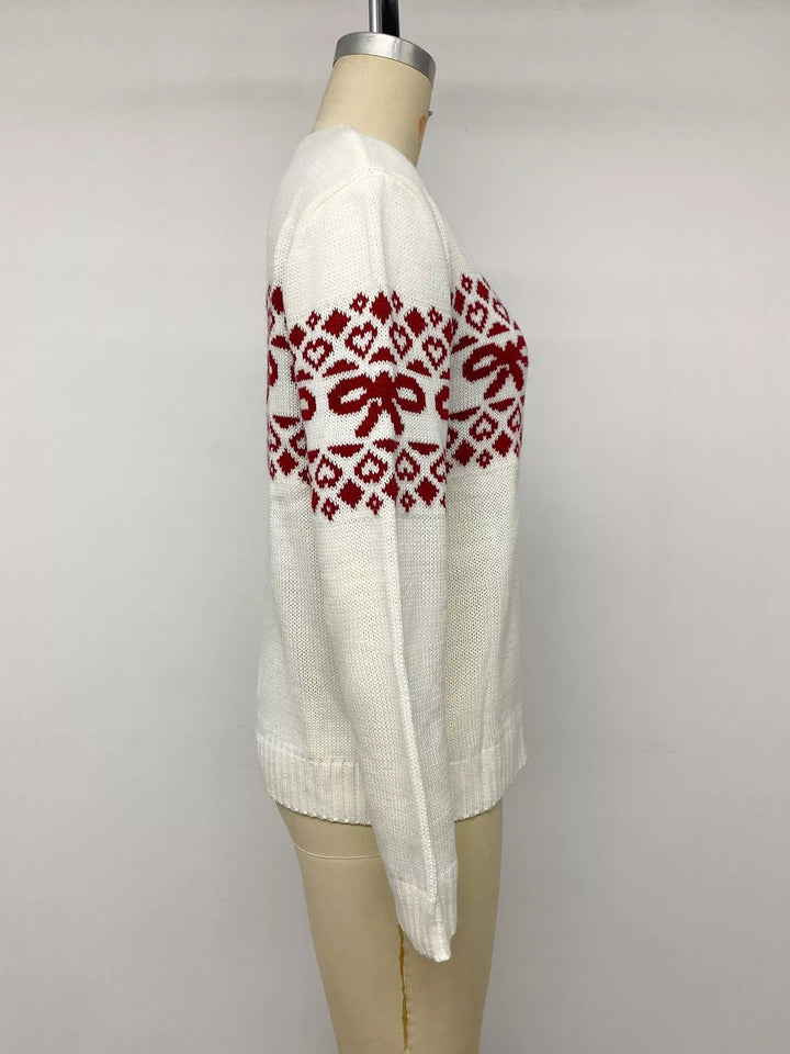 Side view of the white heart jacquard sweater on a mannequin
