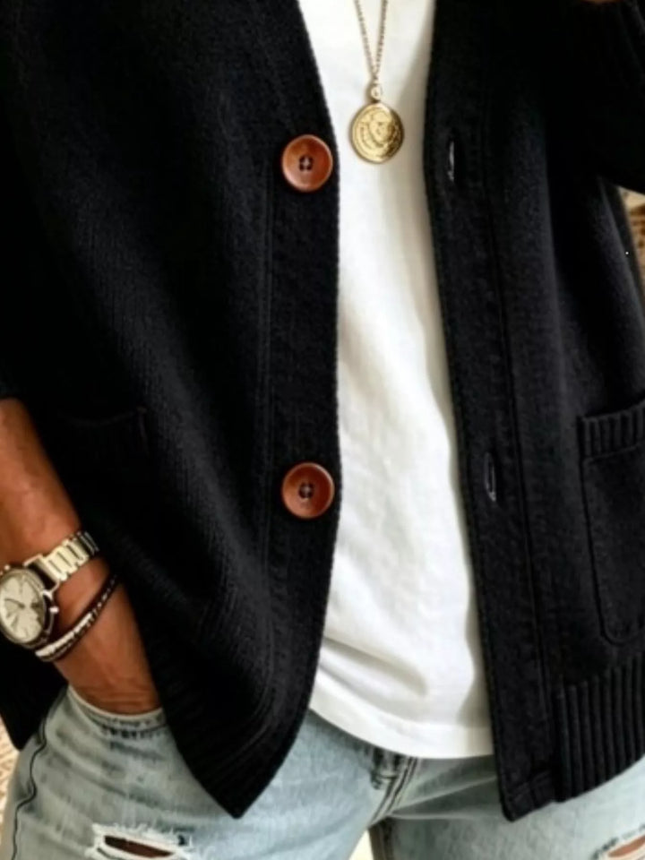Detail of the black cardigan patch pockets and button front