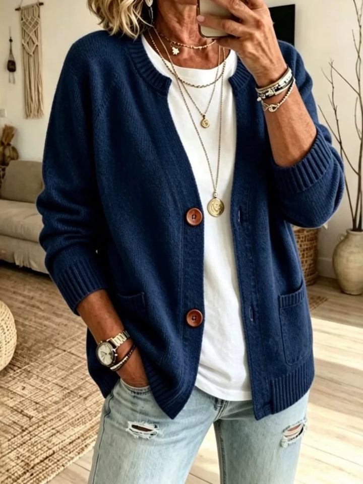 Navy crew neck raglan cardigan with patch pockets, front view