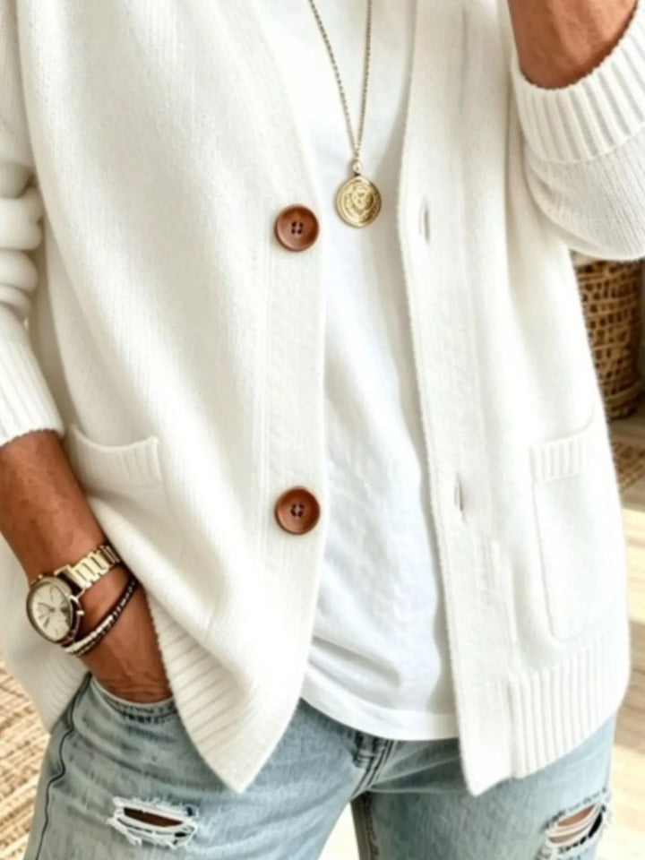 Detail of the white cardigan patch pockets and button front