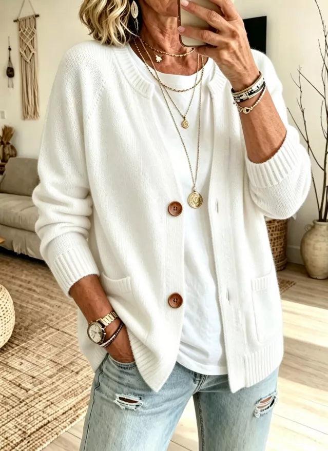 Women's button up cardigan in white with crew neck and patch pockets