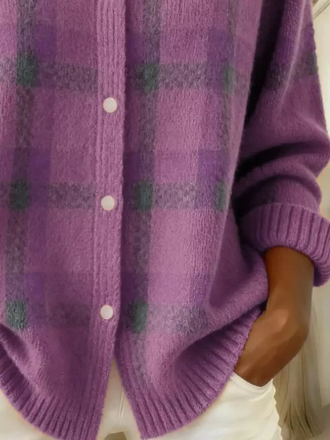 Detail of the orchid plaid cardigan buttons and ribbed cuff