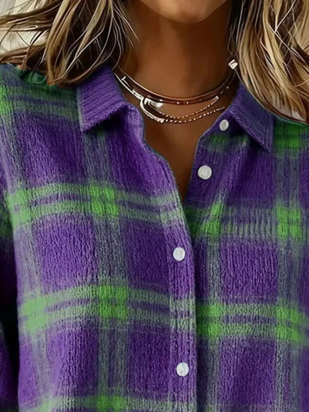 Close-up of the purple plaid cardigan collar and green check