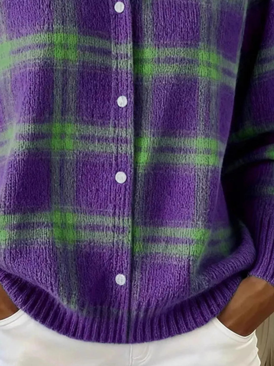 Detail of the purple plaid cardigan buttons and ribbed cuff