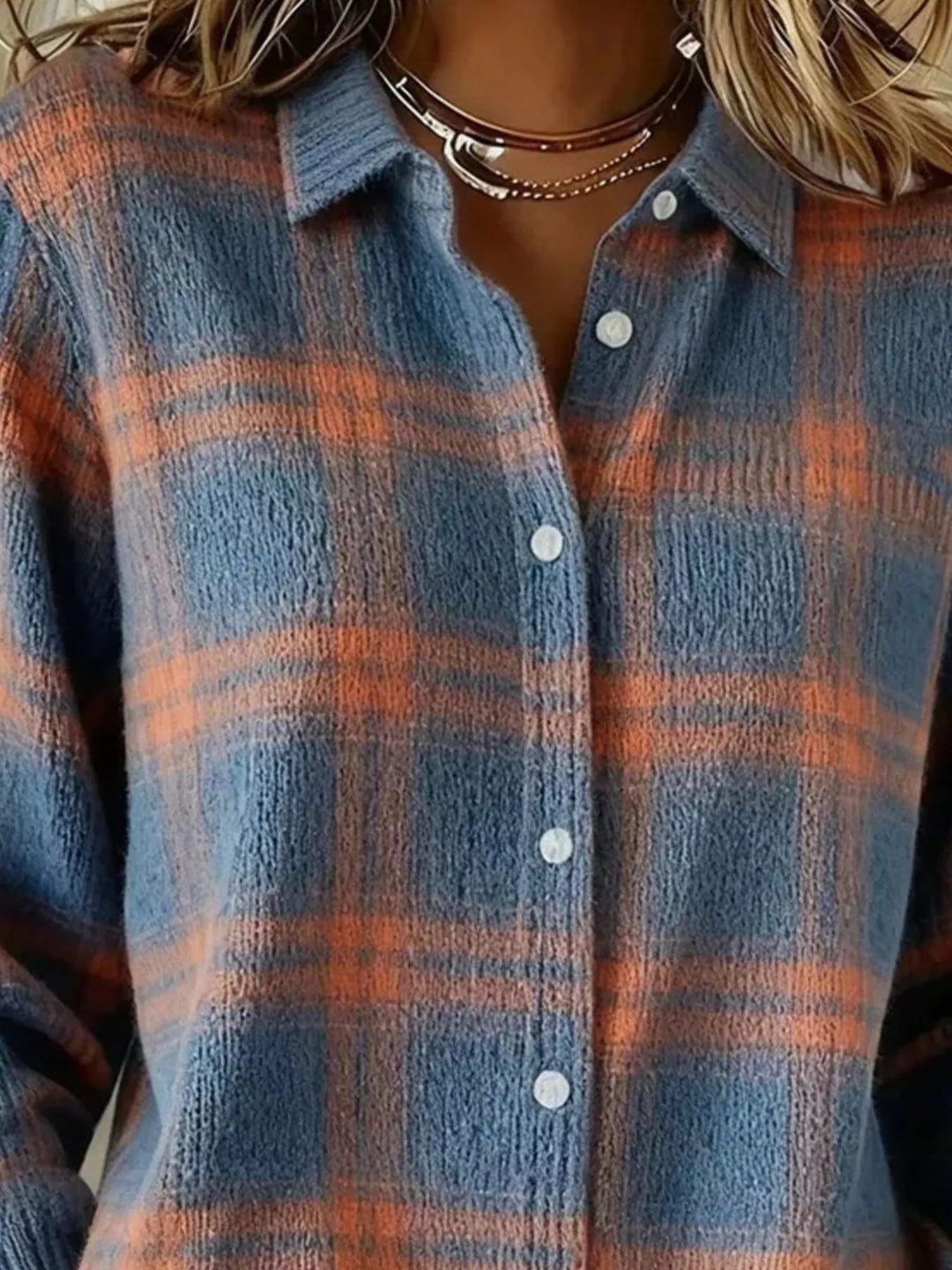 Close-up of the slate blue plaid cardigan collar and buttons